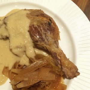 Duck with confit of apple cider sauce