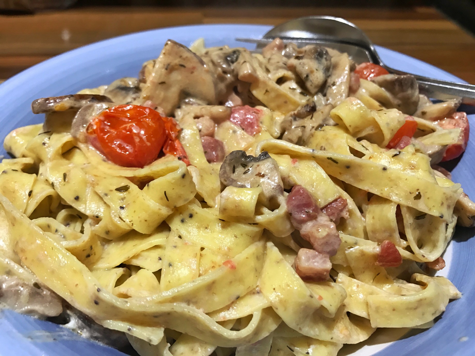 Multigrain tagliatelle with pancetta, mushrooms and cherry tomatoes