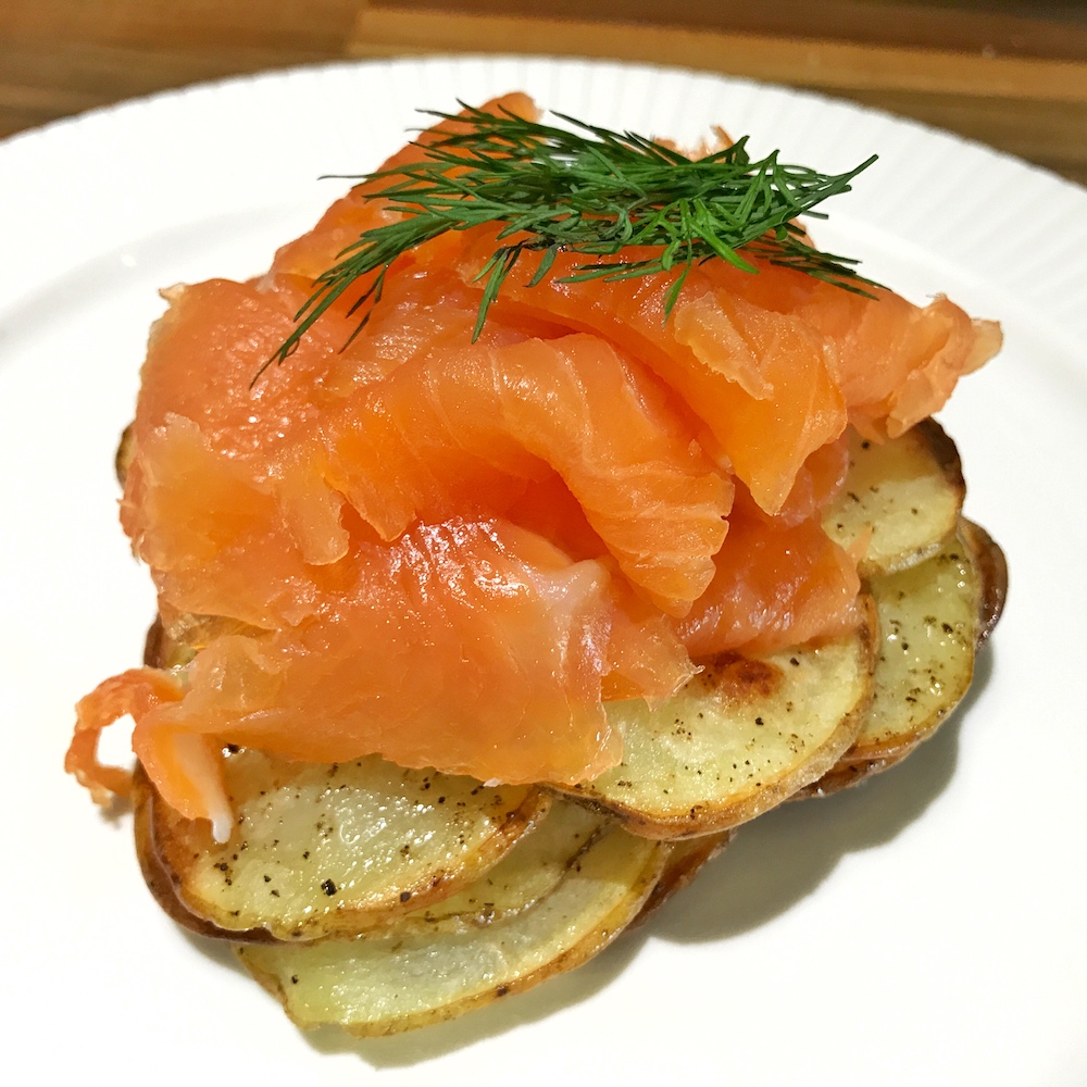 Smoked salmon on sliced potato