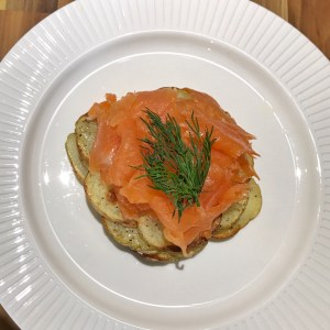 Smoked salmon on sliced potato